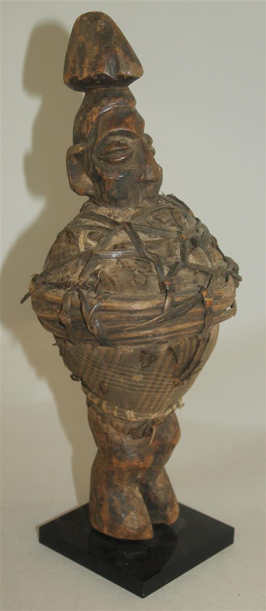 An African Ivory Coast Baule figure of a standing male, largest figure 20.5in.